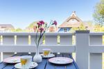 Terrasse mit Tisch und Blumen - Nathalie - Top-Hundeurlaub