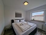 Schlafzimmer - Ferienwohnung Westwind Neßmersiel - Top-Hundeurlaub