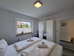 Schlafzimmer - Ferienwohnung Westwind Neßmersiel - Top-Hundeurlaub