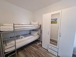 Schlafzimmer - Ferienwohnung Westwind Neßmersiel - Top-Hundeurlaub