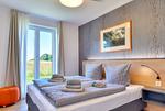 Schlafzimmer - Ferienwohnung Haubentaucher 25 im Wreecher Idyll Rügen - Top-Hundeurlaub