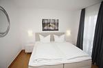 Schlafzimmer - FeWo06:Strand,Terr.,Pool,Sauna - Top-Hundeurlaub