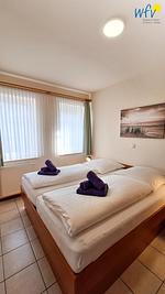 Schlafzimmer - Ferienwohnung Neuer Leuchtturm - Top-Hundeurlaub