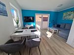 Wohnzimmer - Freiraum-Ferienwohnung Fehmarn Petersdorf - Top-Hundeurlaub
