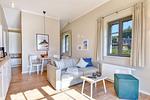 Wohnzimmer - Ferienhaus Strandbude Feriendorf 32 Klein Stresow Rügen - Top-Hundeurlaub