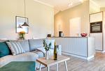 Wohnzimmer - Ferienhaus Frische Brise 33 Feriendorf Klein Stresow Rügen - Top-Hundeurlaub
