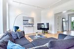Wohnzimmer - Ferienwohnung Fürst Malte Loft I Design & Pool Putbus - Top-Hundeurlaub