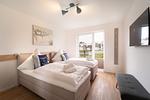 Schlafzimmer - Ferienwohnung Heimathafen Schlei Olpenitz - Top-Hundeurlaub