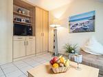 Wohnbereich mit TV - Wohnung 4-63 - Top-Hundeurlaub