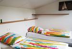 Schlafzimmer - Birkenhain 3b - Lastering Ferienhäuser & Apartments - Top-Hundeurlaub