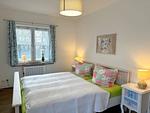 Schlafzimmer 1 mit Doppelbett - Ferienhaus am Lebbiner Bodden - Top-Hundeurlaub