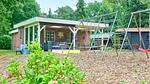 Außenseite Ferienhaus [Sommer] - Ferienhaus für 8 Personen (103 m²) in Reutum - Top-Hundeurlaub