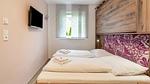 Schlafzimmer - Ferienwohnung für 7 Personen (40 m²) in Bruck an der Glocknerstraße - Top-Hundeurlaub
