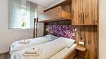 Schlafzimmer - Ferienwohnung für 7 Personen (40 m²) in Bruck an der Glocknerstraße - Top-Hundeurlaub