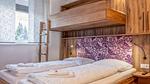 Schlafzimmer - Ferienwohnung für 7 Personen (40 m²) in Bruck an der Glocknerstraße - Top-Hundeurlaub