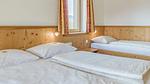 Schlafzimmer - Ferienwohnung für 14 Personen (151 m²) in Brixen im Thale - Top-Hundeurlaub