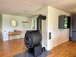 Wohnzimmer mit Kamin in der Villa Bergsmåla - Villa Bergsmåla - Top-Hundeurlaub