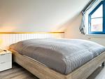 zweites Schlafzimmer im Dachgeschoss mit Doppelbett - Wohnung 03-5 - Top-Hundeurlaub