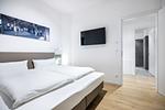 Schlafzimmer mit Doppelbett und TV - Krusespeicher 3-47 - Top-Hundeurlaub