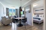 Wohnzimmer - Deluxe-Apartment 2.14 mit eigener e-Ladesäule, XL-Strandkorb und Hundefreundlich - Top-Hundeurlaub