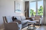 Wohnzimmer - Deluxe-Apartment 2.14 mit eigener e-Ladesäule, XL-Strandkorb und Hundefreundlich - Top-Hundeurlaub