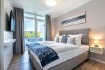 Schlafzimmer - Deluxe-Apartment 2.14 mit eigener e-Ladesäule, XL-Strandkorb und Hundefreundlich - Top-Hundeurlaub