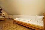 Schlafzimmer - Wohnung 04: Balkon, Boddenblick, Sauna- und Schwimmbadnutzung - Top-Hundeurlaub