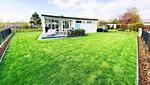 Gartenblick - Ferienhaus Mimibeach in Scharbeutz 350 m zum Strand - Top-Hundeurlaub