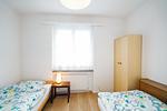 Schlafzimmer mit zwei Einzelbetten - Apartment Im Aeschen - Top-Hundeurlaub