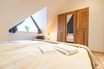 Schlafzimmer - Hello Holidays: Haus Luft | Penthouse | Sauna | Park - Top-Hundeurlaub