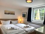 Schlafzimmer - Wohnung 2 Ost - Top-Hundeurlaub