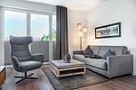Wohn-/Essbereich mit Doppelschlafcouch - Aparthotel Ostseeallee 1-01 - Top-Hundeurlaub