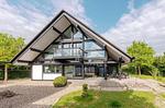 Ferienhaus HUF-Haus in Waren (Waren Müritz) Außenansicht vom Haus mit Balkon - HUF-Haus - Top-Hundeurlaub