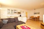 Wohnzimmer mit Blick auf Essbereich - Wohnung 39 - Top-Hundeurlaub