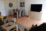 Essbereich und TV im Wohnzimmer - Wohnung 029 - Top-Hundeurlaub