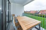 Überdachter Balkon mit Sitzgelegenheit - Deichhäuser Anna Küste 8-20 - Top-Hundeurlaub