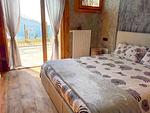 großes weiches Bett und Zugang zur Terrasse - Rustico Bella Vita Bungalow - Top-Hundeurlaub