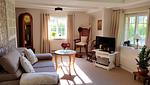 Wohnzimmer mit Couchecke - Friesenhaus Martensen - Top-Hundeurlaub