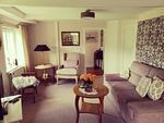 Wohnzimmer mit Couchecke - Friesenhaus Martensen - Top-Hundeurlaub