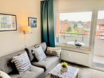 Wohnzimmer mit Ausgang zum Balkon - Haus Nordland App. 29 (Stelter) - Top-Hundeurlaub