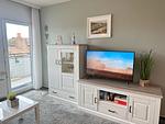 Wohnzimmer mit Fernseher - Haus Nordland App. 29 (Stelter) - Top-Hundeurlaub