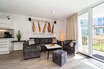 Sofa im Wohnzimmer - Dünenvilla 10 Wohnung 02 - Top-Hundeurlaub