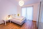 Schlafzimmer 2, Doppelbett - City Dream 1 by Alpenidyll Apartments - Top-Hundeurlaub