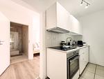 Ansicht auf die vollausgestattete Küche - Charmantes Appartement am Hafen mit gratis Bettwäsche-Paket und Terrasse - Top-Hundeurlaub