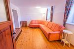 Living room with a sofa bed - Hoamathaus I by Alpenidyll Apartments - Top-Hundeurlaub