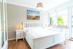 Doppelbett im Schlafzimmer - Wohnung 02 - Top-Hundeurlaub