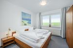 Schlafzimmer mit Doppelbett - Hus Strandkieker 08 - Top-Hundeurlaub