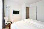 Schlafzimmer mit Doppelbett - Deichhäuser Anna Küste 4-10 - Top-Hundeurlaub