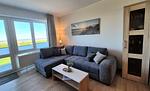 Wohn-Essbereich mit Couch - Hus Strandkieker 03 - Top-Hundeurlaub