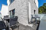 Dachterrasse mit Tisch und Sitzgelegenheit - Aparthotel Ostseeallee 1-03 - Top-Hundeurlaub